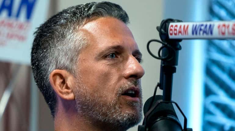 Sports analyst guest host Bill Simmons engages Mike Francesa during...