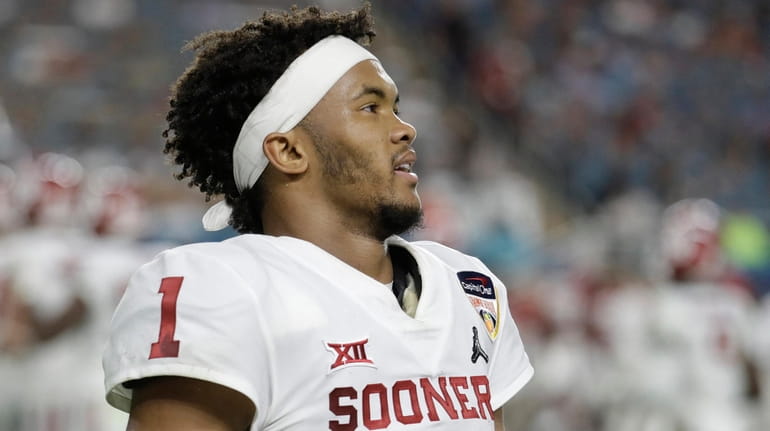 Oklahoma quarterback Kyler Murray looks up during the first half of...