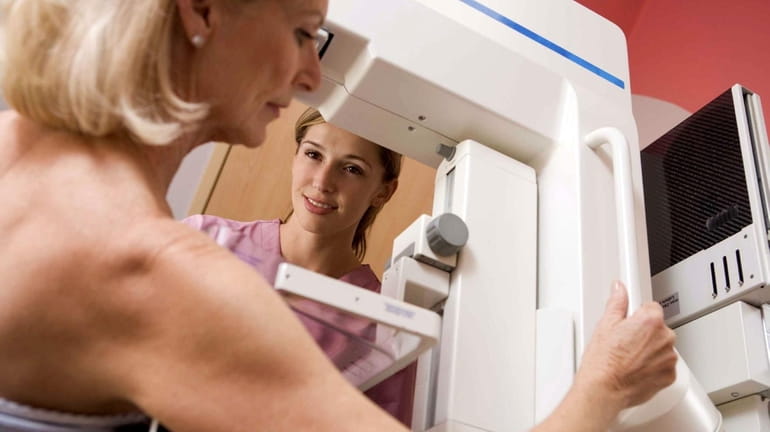 A patient receives a mammogram.