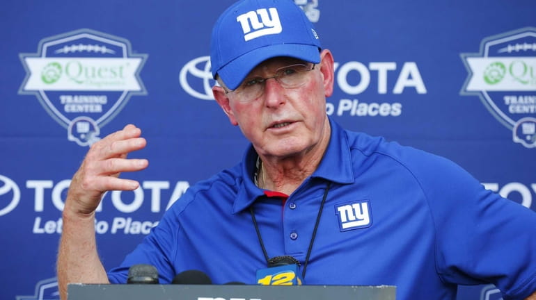 Head Coach Tom Coughlin of the Giants speak to the...