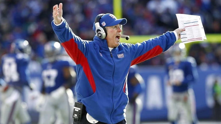 New York Giants head coach Tom Coughlin reacts on the...