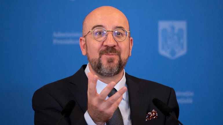 European Council President Charles Michel gestures during a press conference...