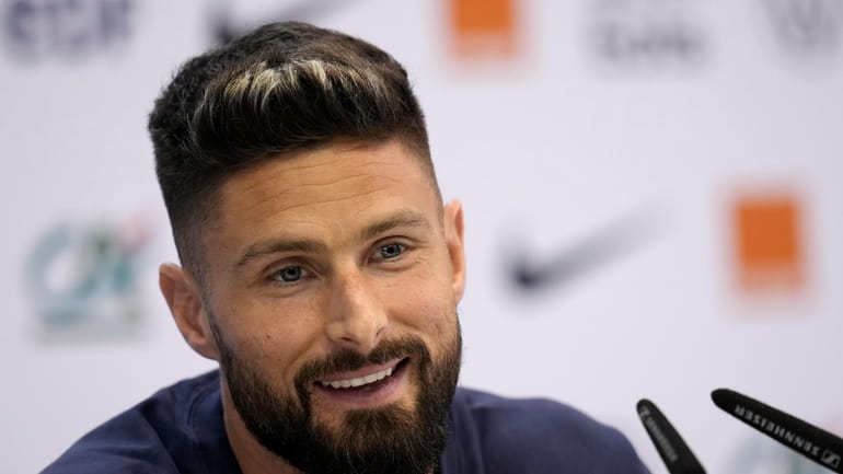 France's Olivier Giroud answers a question during a press conference...