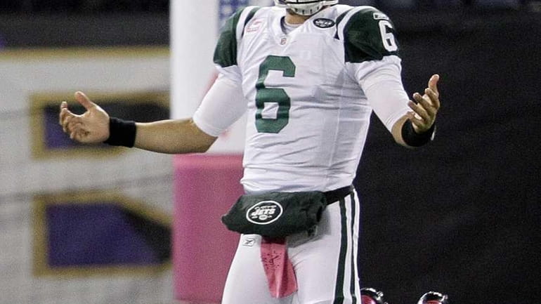 New York Jets quarterback Mark Sanchez reacts to a sack...