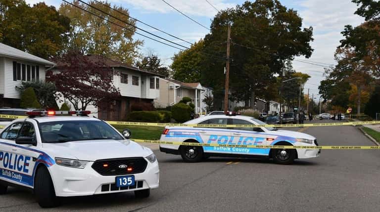 Suffolk County police cars block traffic on Old Country Road...