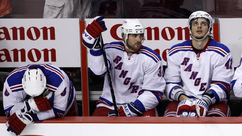 New York Rangers' Brandon Prust, from left, Aaron Voros and...