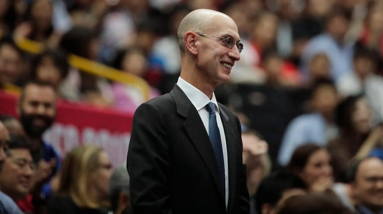 NBA Commissioner Adam Silver is introduced during a preseason game between...
