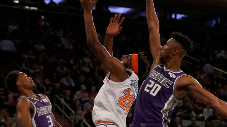 Mitchell Robinson #26 of the New York Knicks puts up...