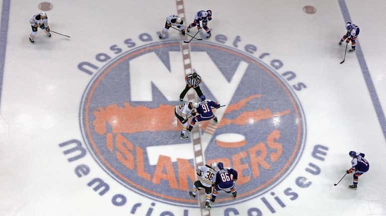 The New York Islanders faceoff aginst the Buffalo Sabres at...