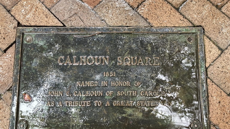 A plaque marking the 1851 dedication of Calhoun Square in...
