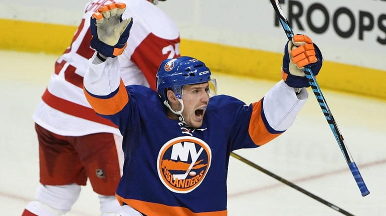 New York Islanders center Casey Cizikas, front, reacts to a...