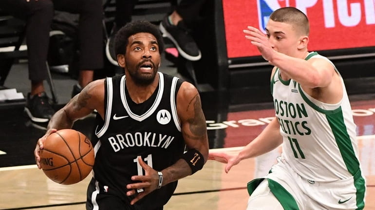 Brooklyn Nets guard Kyrie Irving drives to the basket against...