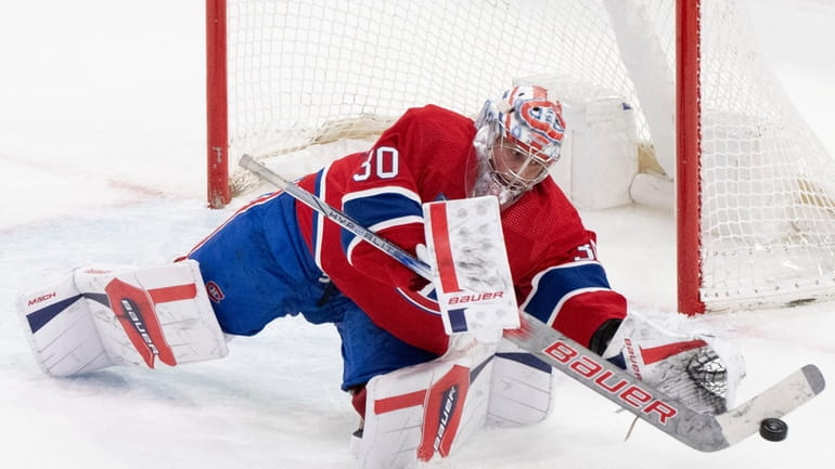 Montreal Canadiens goaltender Cayden Primeau makes a save against the...