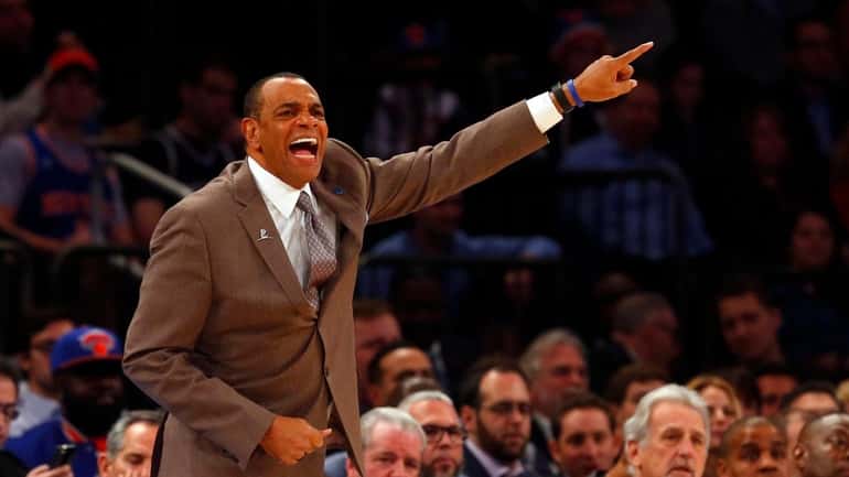 Lionel Hollins of the Brooklyn Nets reacts during a game...