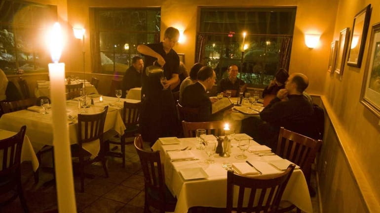 Diners peruse their menus at Pentimento in Stony Brook Village...