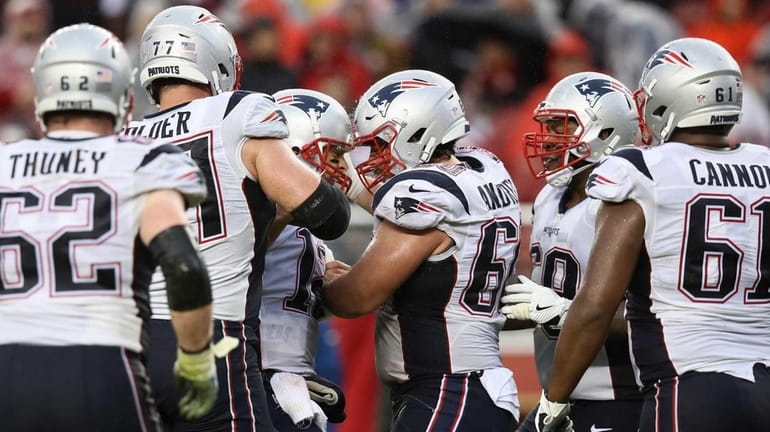 Tom Brady #12 of the New England Patriots celebrates with...