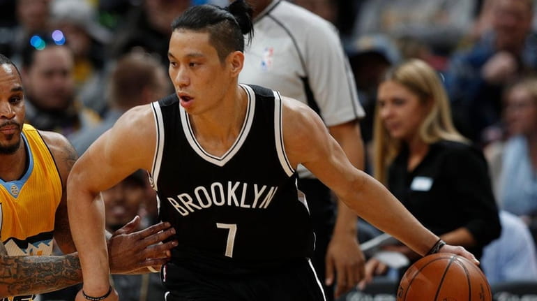 Nets guard Jeremy Lin, right, here working the ball against...