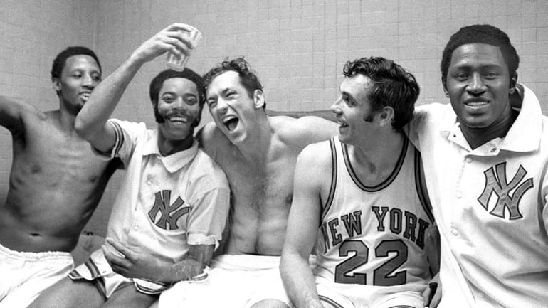 Bill Bradley, center, with his Knicks teammates in a photo...