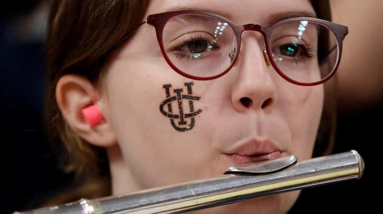 A UC Irvine band member performs before the second half...