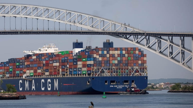 A container ship travels near the Bayonne Bridge in 2021....