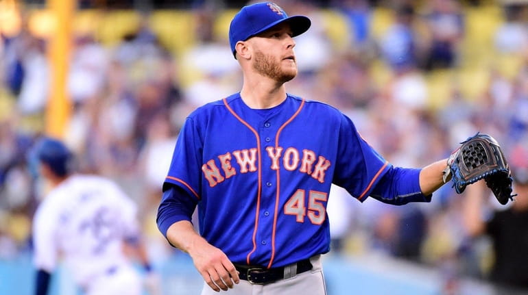 Zack Wheeler of the Mets reacts during the first inning...