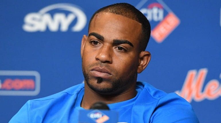 Mets' Yoenis Cespedes looks on during a news conference at...