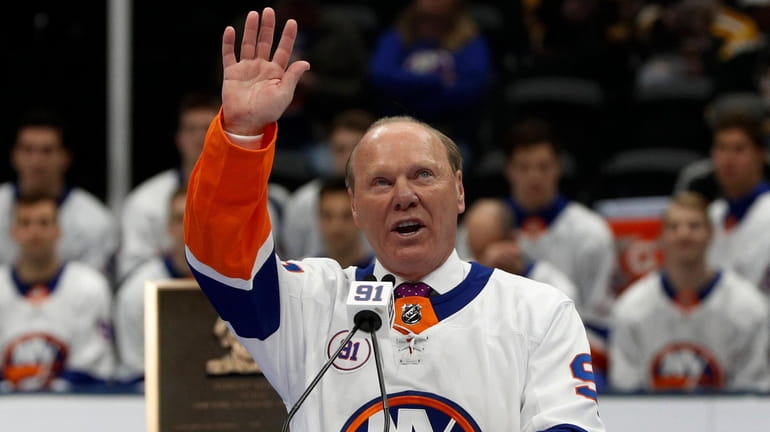 Butch Goring waves to the crowd during his jersey retirement...