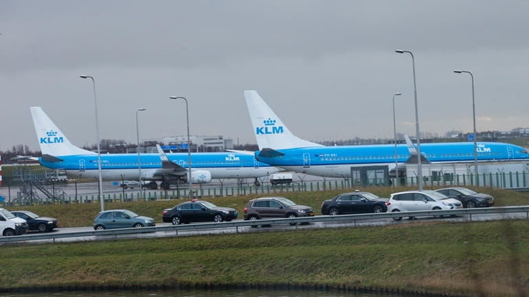 KLM airplanes sit in Schiphol Airport near Amsterdam, Netherlands, on...