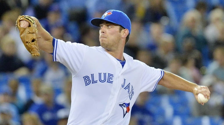 Then-Blue Jays starting pitcher Sean Nolin works against the Orioles in...