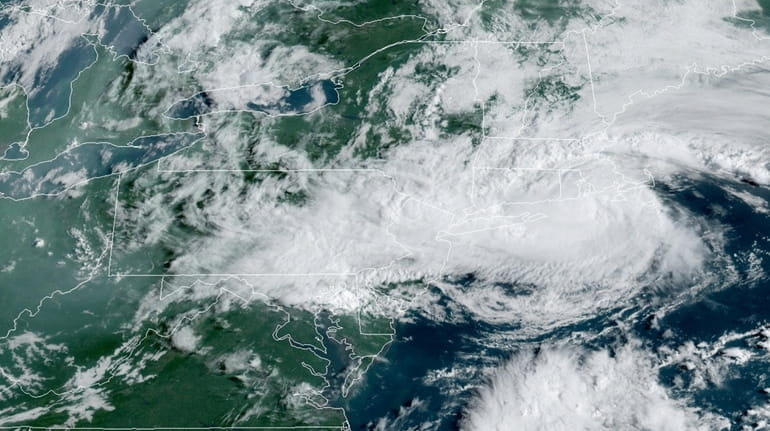 Satellite image shows Tropical Storm Henri moving past Long Island...