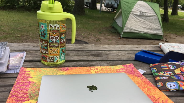 When camping, placemats can serve as the base for laptops and protect...