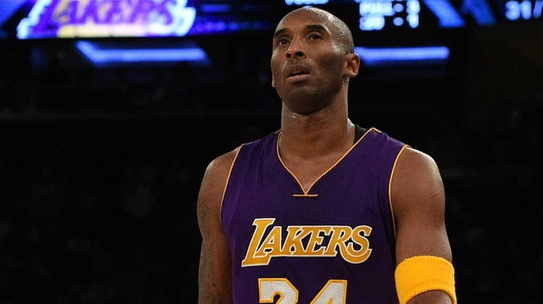 Los Angeles Lakers forward Kobe Bryant looks on against the...