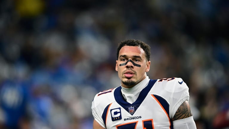 Denver Broncos safety Justin Simmons is seen during warmups before...