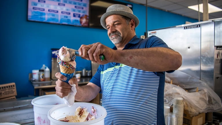 Owner Charlie Mattina makes a cone at Frozenside in Oceanside.