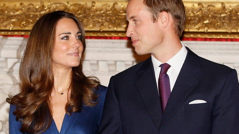 Britain's Prince William and his then fiancee Kate Middleton pose...