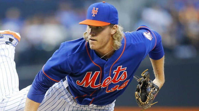Noah Syndergaard #34 of the Mets pitches against the Arizona...