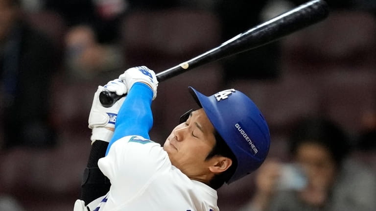 Los Angeles Dodgers' designated hitter Shohei Ohtani swings during the...