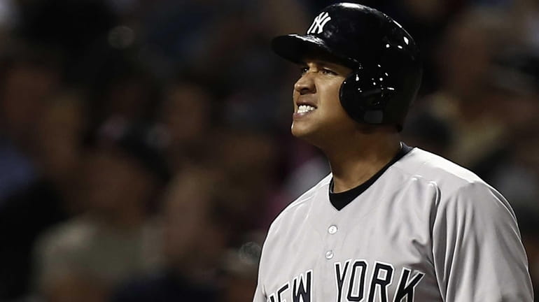 Yankees' Alex Rodriguez grimaces after fouling off a pitch during...