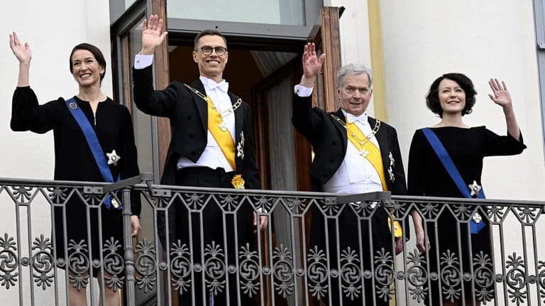 The new President of Finland Alexander Stubb, center left, and...