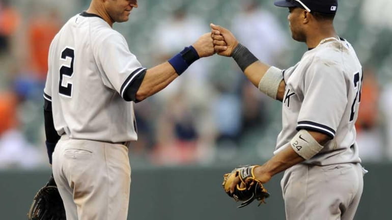 Derek Jeter and Robinson Cano celebrate their 6-3 win over...