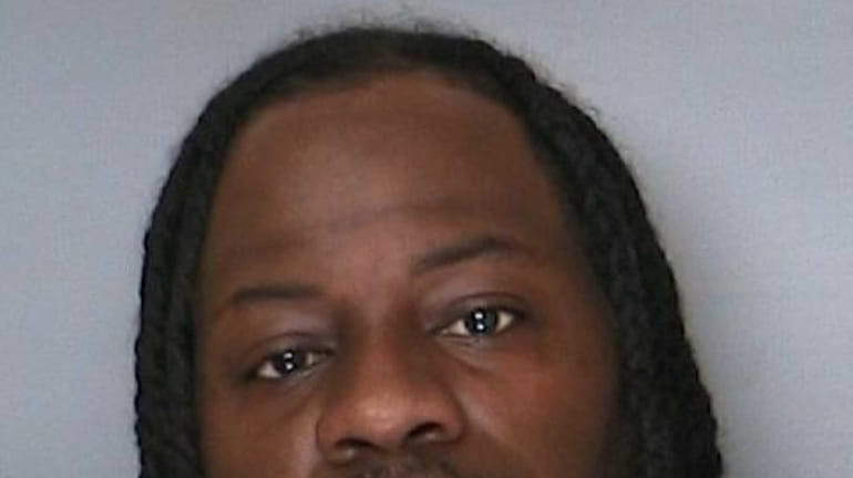 Torey Warren, 34, of Amityville, was charged with shooting and...