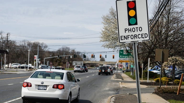 Nassau and Suffolk officials attribute the drop in red-light camera...