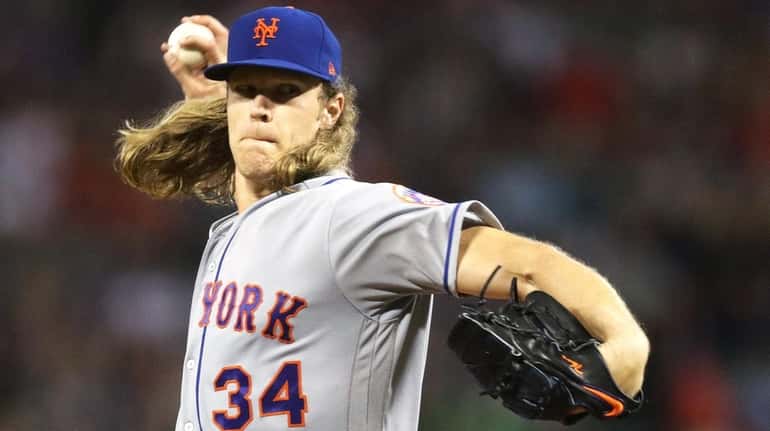 Noah Syndergaard #34 of the New York Mets pitches against...