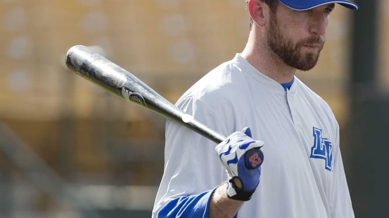 Ike Davis waits his turn during batting practice with the...