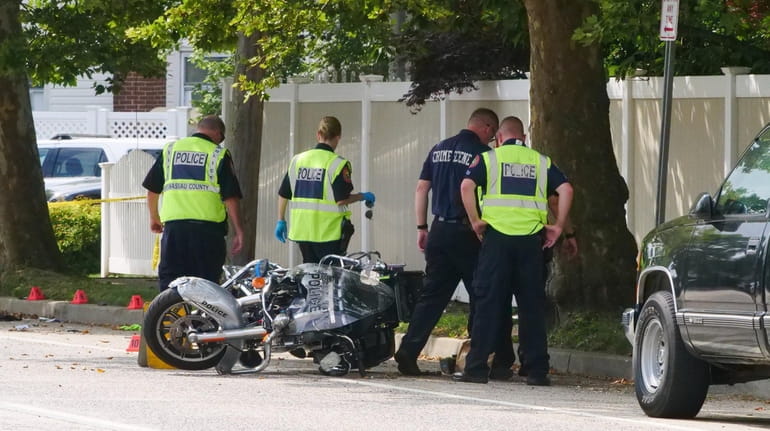 A Nassau police officer riding his motorcycle was struck in...