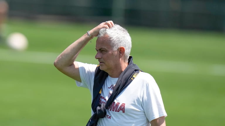Roma's head coach Jose Mourinho attends a training session ahead...