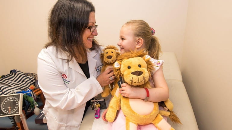 Dr. Jennifer Osipoff meets with her Type 1 diabetes patient,...