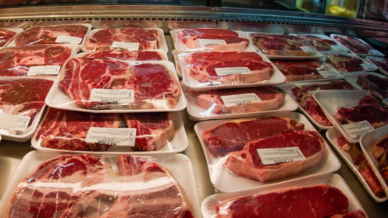 Rows of fresh cut beef are displayed in the coolers...