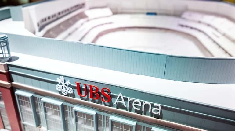 A detailed model of the UBS Arena is displayed at...