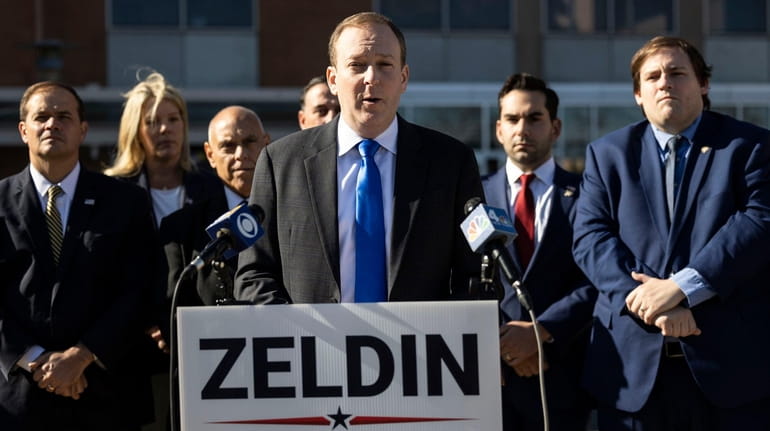 Rep. Lee Zeldin is joined by elected officials as they...